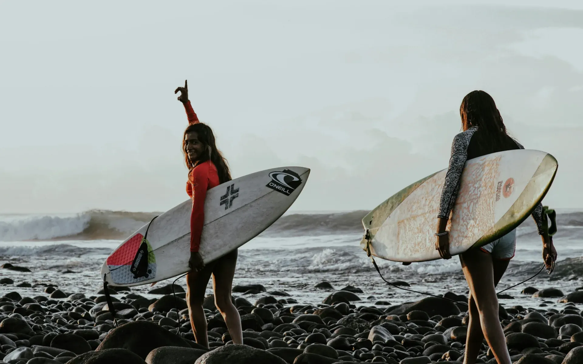 Women surfing in El Salvador