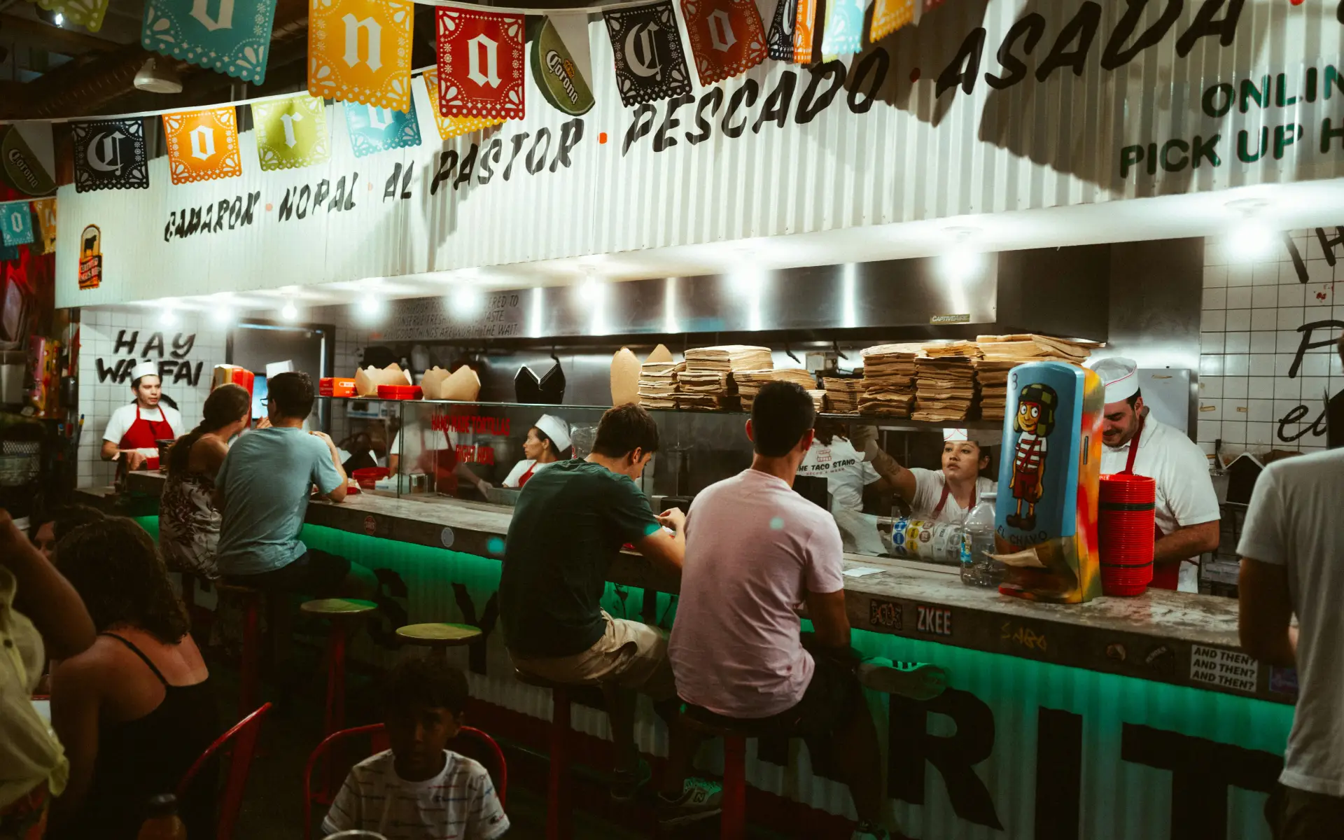 People sit at a food counter in Miami